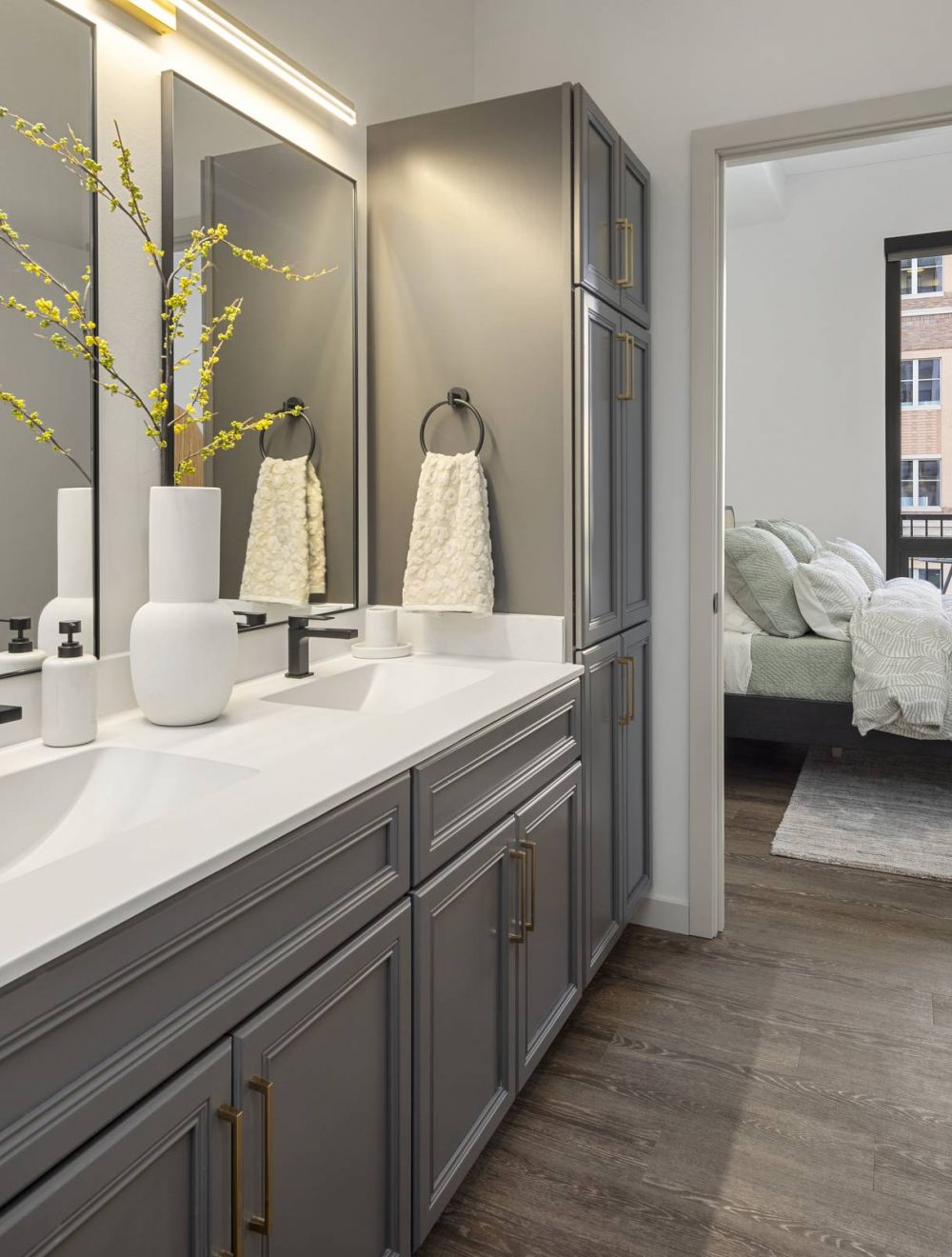 O2 Luxury Towers apartments penthouse living room with hardwood floor, fireplace, and open-floor plan layout.