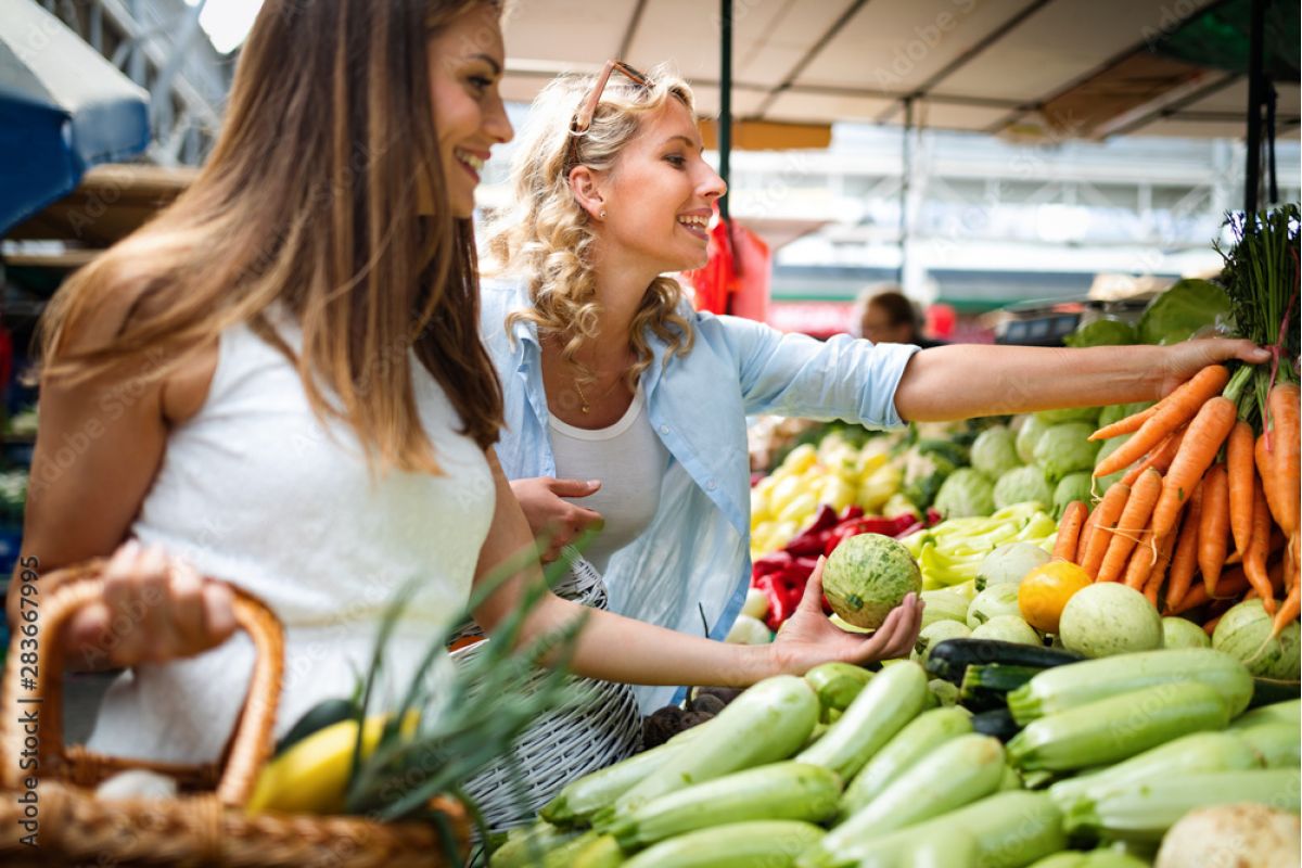 Women shopping at a farmer's market in Minneapolis, MN