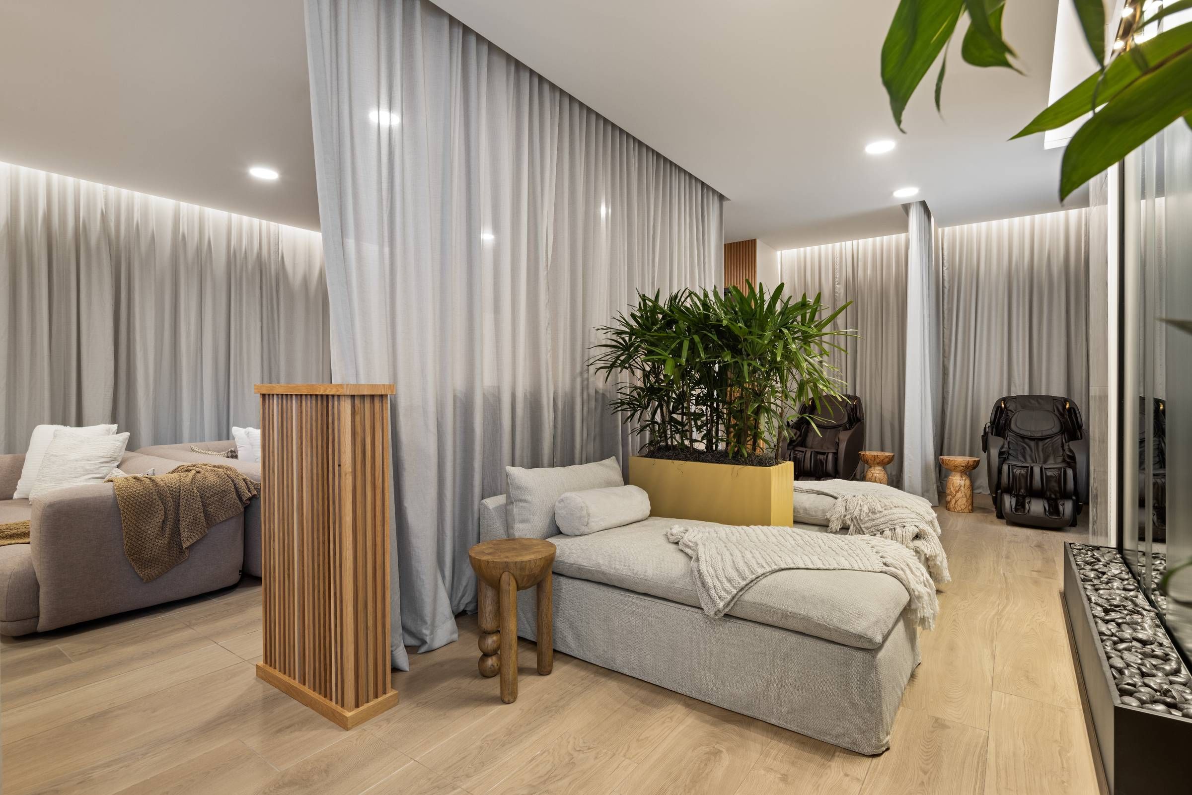 O2 Apartments rendering of relaxation spa with plush seating, massage area, and calming decorations.