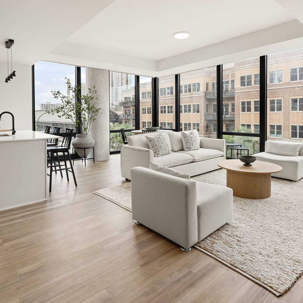 O2 Luxury Towers apartments open-floor plan layout with wooden floors.